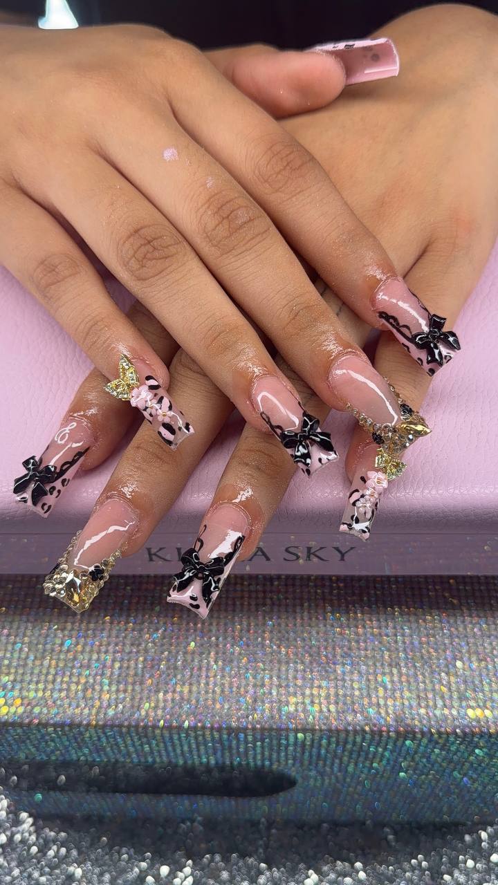 Black coquette bow French tips with leopard print by Tay